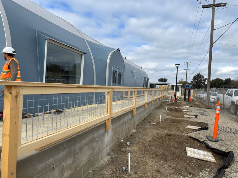 A modern house with a well-maintained exterior, showcasing the quality of residential construction services offered by Cal Vesna Construction Inc.